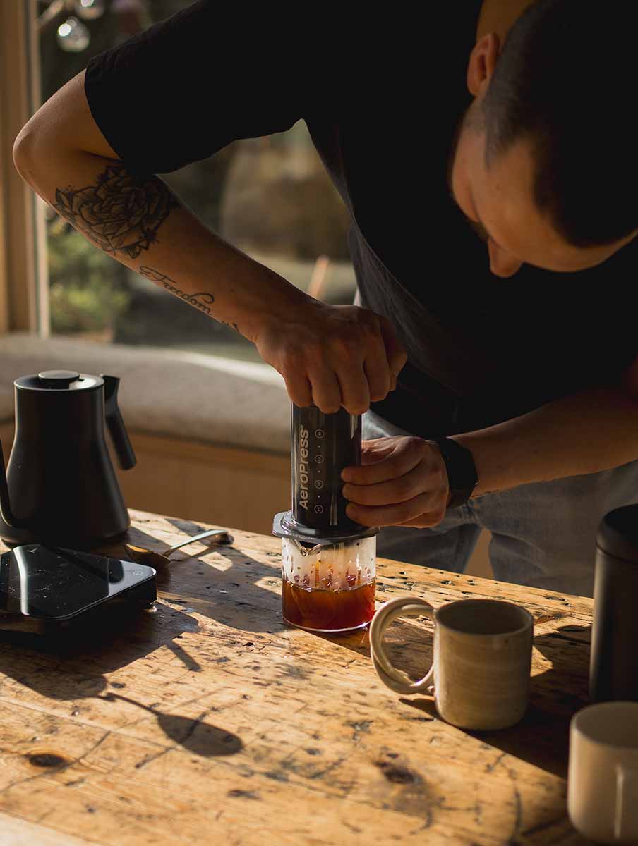 Coffee being made in AeroPress being pushed into Kinto coffee server