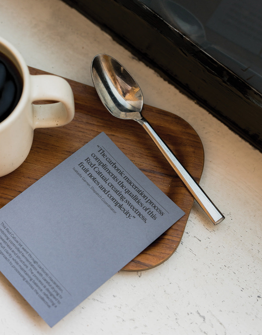 The Lady, Horizons Filter coffee  information card next to a spoon and monoware mug