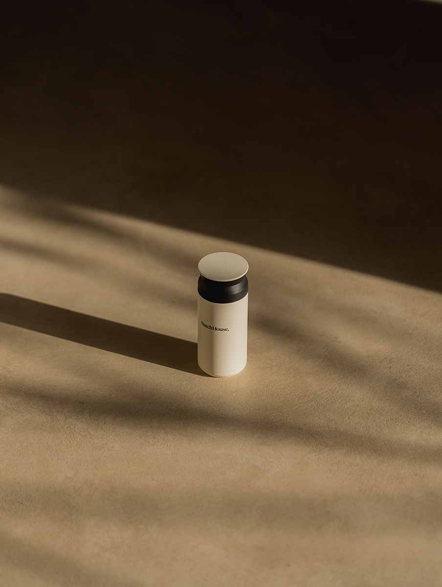 Kinto tumbler sitting on the floor in the sun.